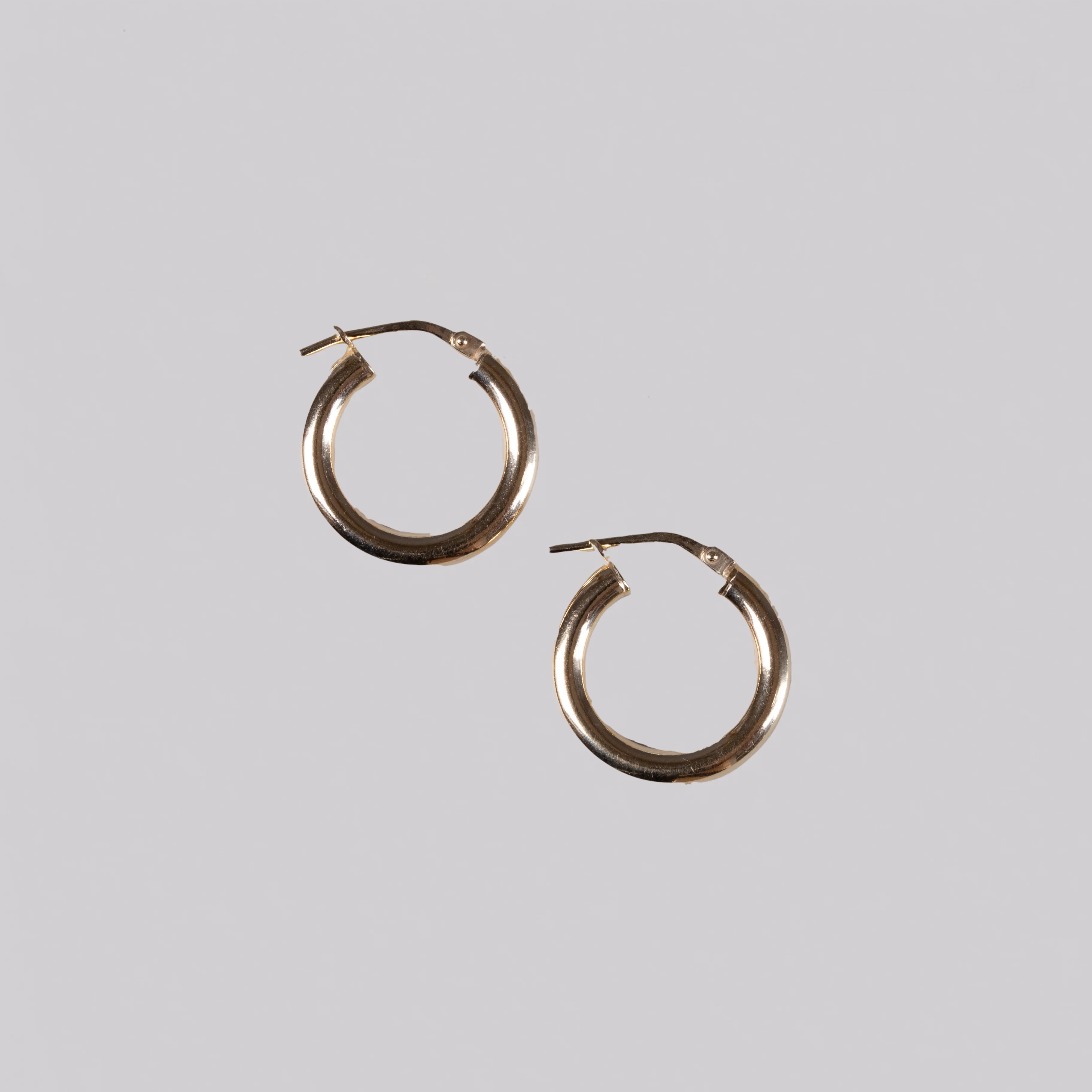 Tube Hinged Hoop Earrings in Gold & Silver - Image 2