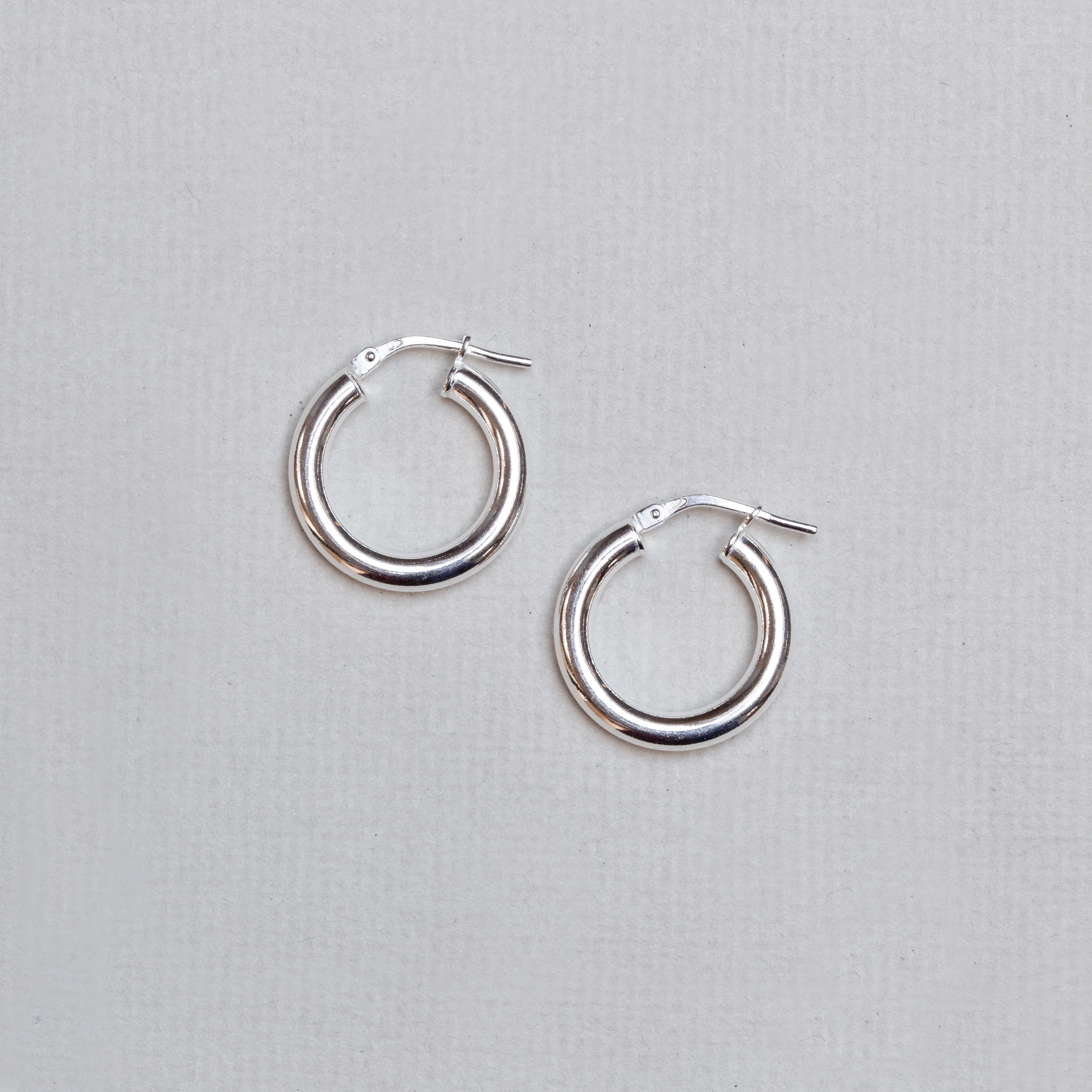 Tube Hinged Hoop Earrings in Gold & Silver - Image 3