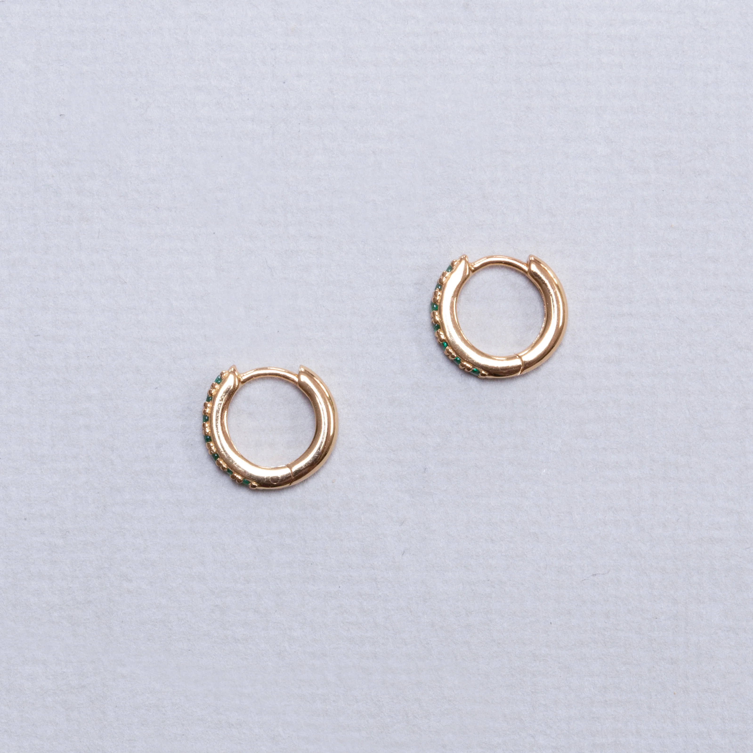 Huggie Hoop Earrings with Green Cubic Zirconia - Image 3