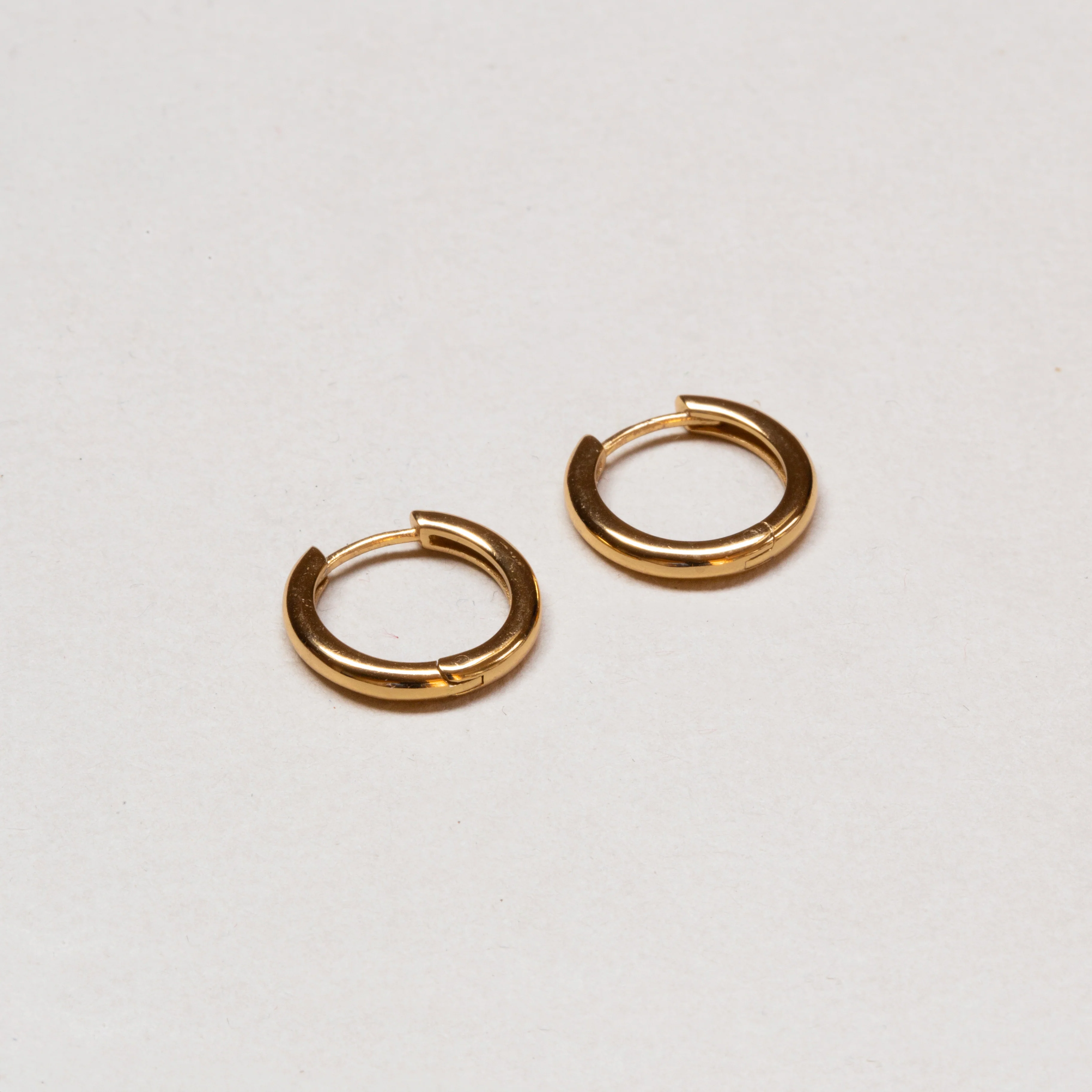 Simple Gold Huggie Hoop Earrings - Image 4