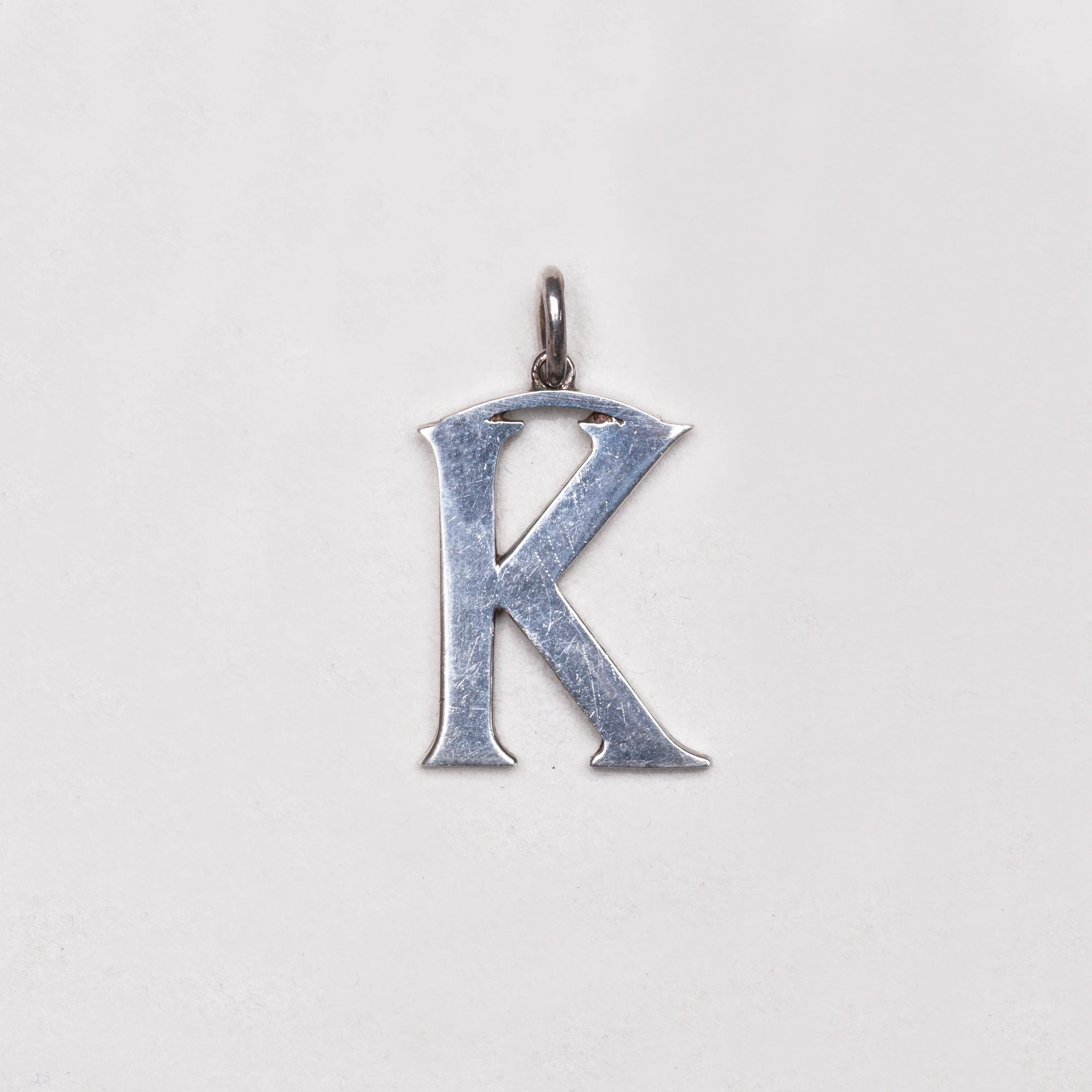 Vintage Cassandra Goad "K" Charm Pendant in Sterling Silver - Image 2